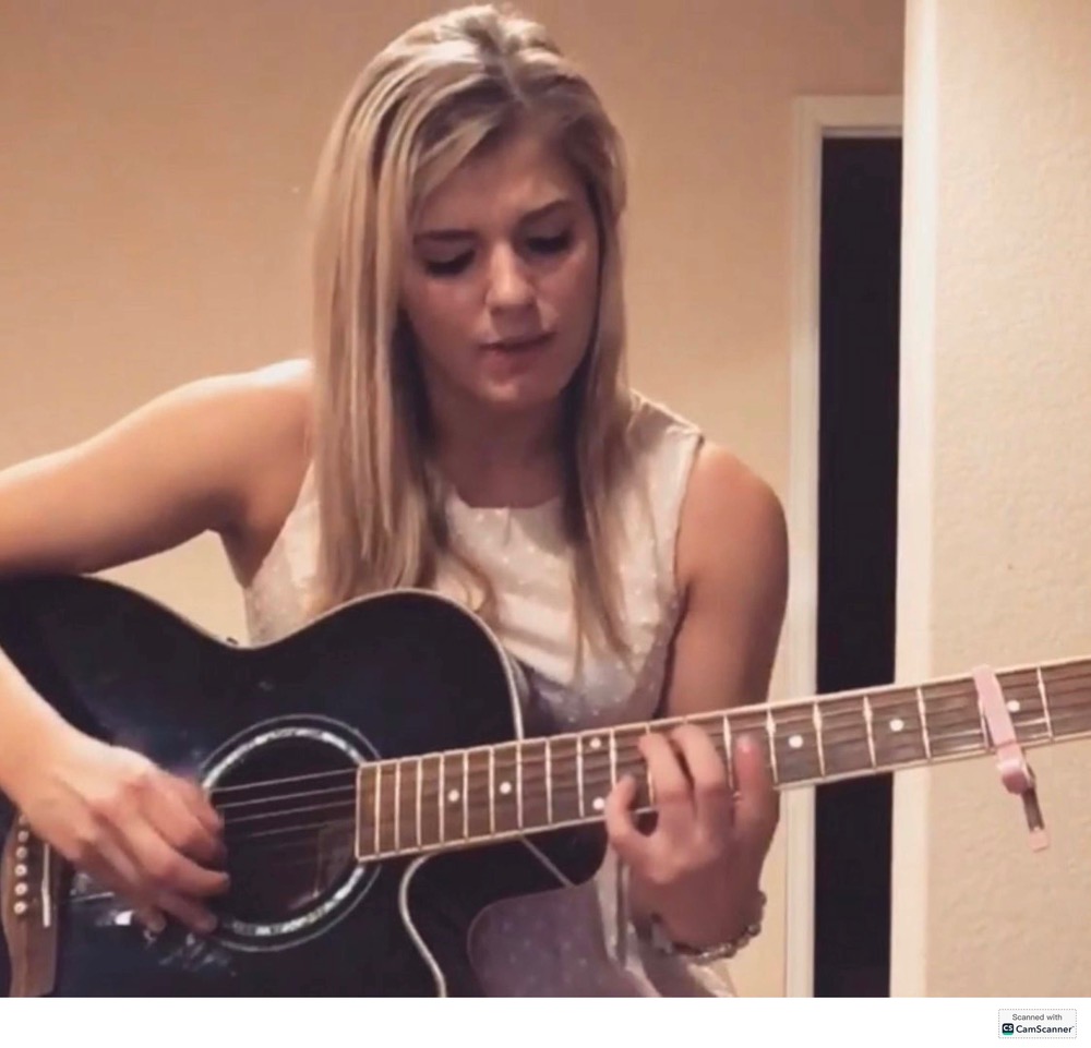 Samantha Hiller with her guitar